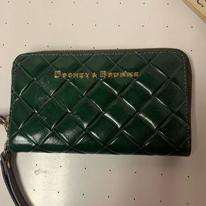 Beautiful, green leather, Dooney and Bourke wallet with red interior. Never used